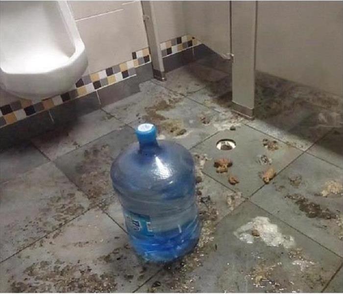 Sewage backup in public bathroom