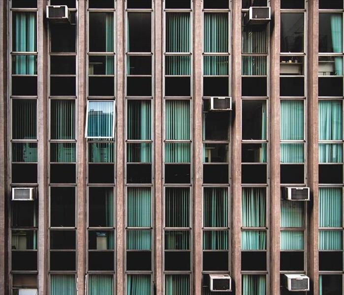 air conditioner units in an apartment building
