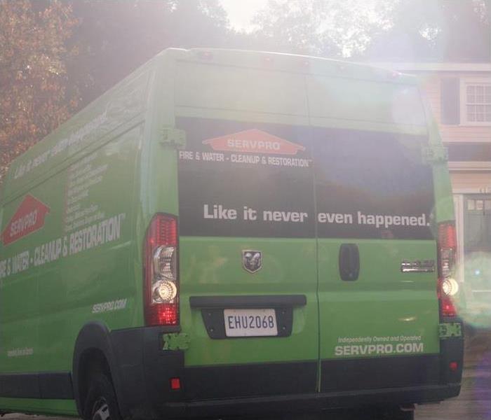 the back of a green SERVPRO truck